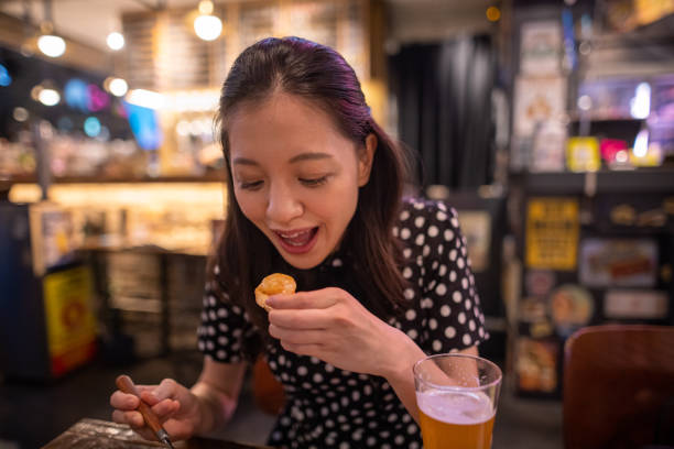 istock Young woman eating Ahijo on bread for dinner 1284998323