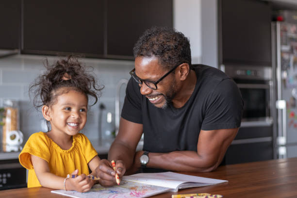 istock Loving father coloring with adorable daughter 1284998996