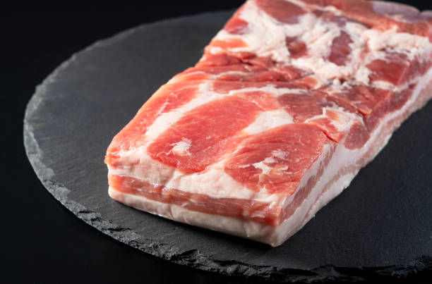 istock Pork belly on a black stone tray 1284999599