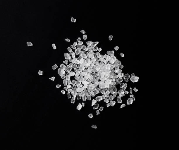 istock Himalayan rock salt on a black background. A view from above 1284999643