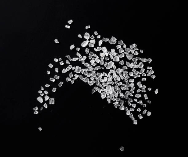 istock Himalayan rock salt on a black background. A view from above 1284999828