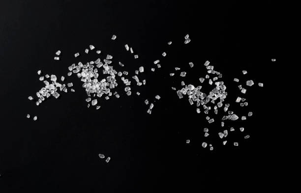 istock Himalayan rock salt on a black background. A view from above 1284999936