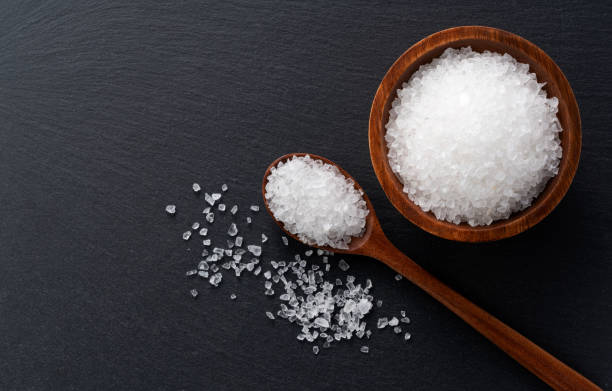 istock Himalayan rock salt placed on a black background with space. A view from above 1285000006