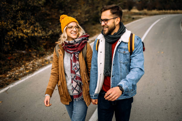 istock Couple having fun time on countryside walk 1285000626