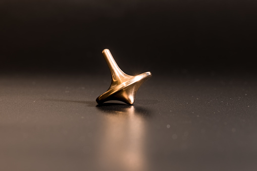 Die Cast Spinning Top Silhouetted with gold color