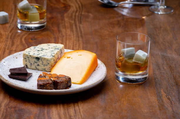 istock Tasting and pairing of different cheeses with strong alcoholic drinks, whisky, cognac or calvados 1285001775