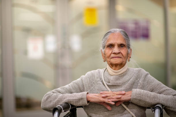 istock Elderly woman in a wheelchair 1285003123