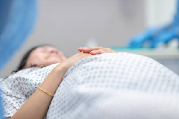 istock Pregnant woman lying on an operation table 1285009836