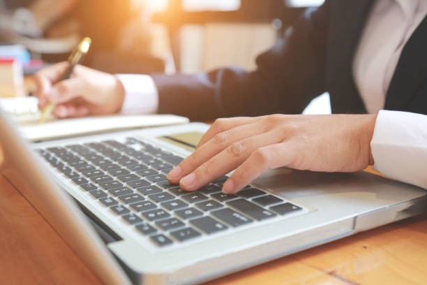 istock Business people are using their notebooks to find investment information. 1285012207