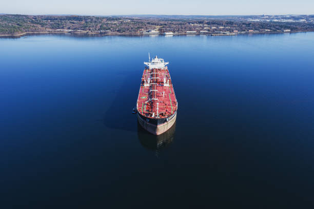 An oil tanker anchored in a still harbour.