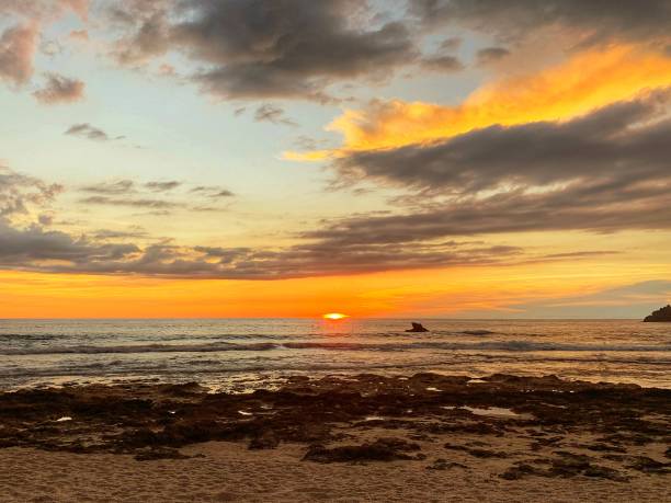 istock Beautiful sunset and cloudscape over the ocean 1285019790