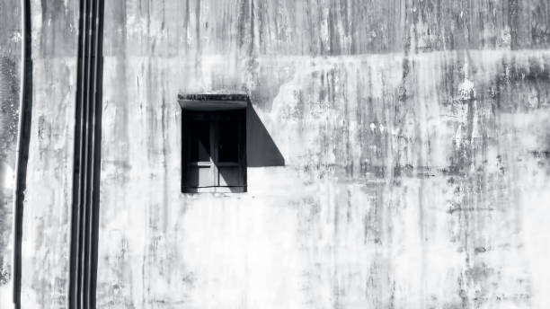 istock Shot of an old school type window inside an old building in black and white. 1285025731