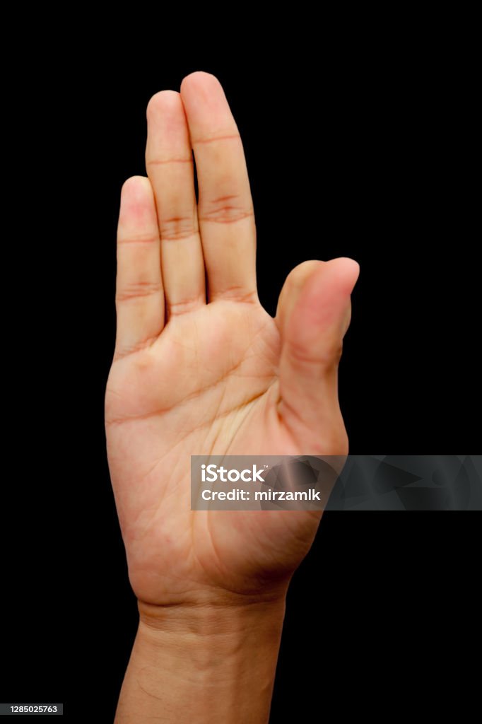 Shot of male hands isolated on black background demonstrating Kalesvara mudra. Active Lifestyle Stock Photo