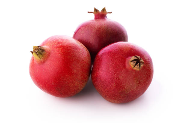 Ripe pomegranate fruits isolated on white background