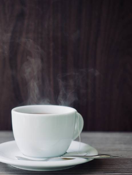 istock Tea on wooden boards and porcelain cups, black tea 1285033231