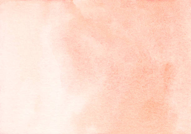 istock Watercolor light coral background texture. Pastel brown-pink gradient backdrop. Stains on paper, hand painted 1285037262