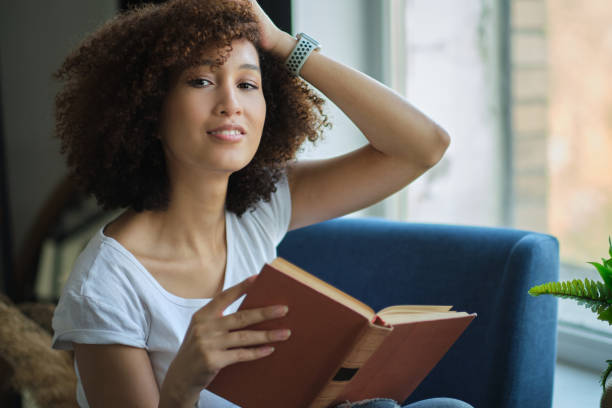 istock Portrait beauty relaxed Woman reading book. 1285037897