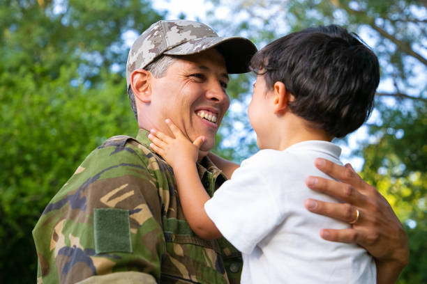 istock Joyful father holding little son in arms 1285038198
