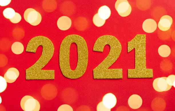 istock Happy New year 2021 celebration. Gold numeral 2021 and lights. 1285038199