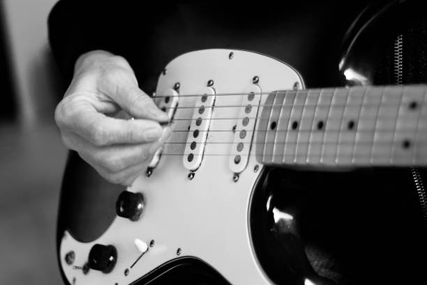 istock Close up of hands playing guitar 1285038225