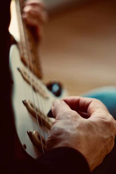 istock Close up of hands playing guitar 1285038766