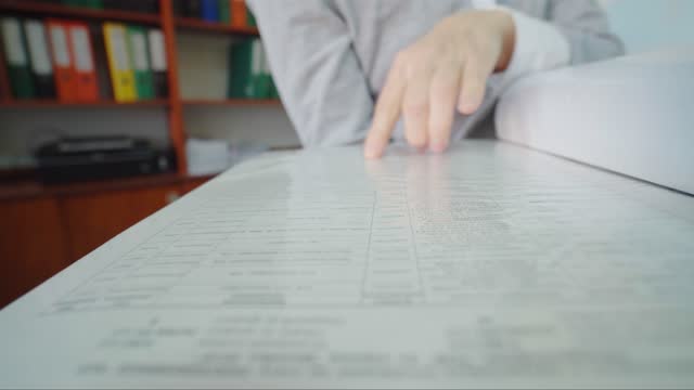 Close up shot. Female hands of office worker or accountant. open document folder.
