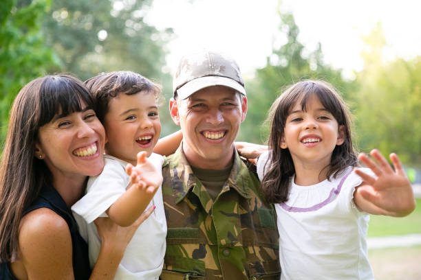 istock Joyful military man posing for camera with his wife 1285041186