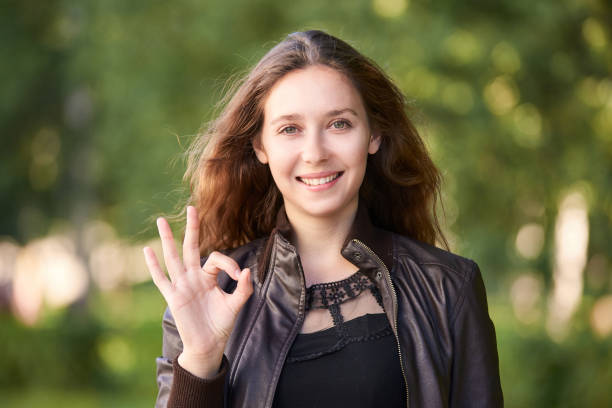 istock Girl gesture ok outdoor. Square 1285041357