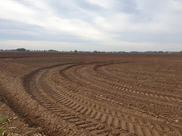 istock Freshly ploughed field in autumn spring 1285042384