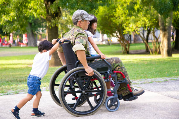 istock Disabled retired military man walking with children 1285042764