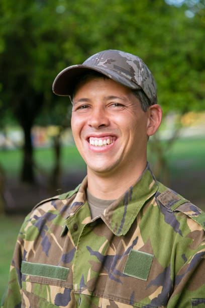 istock Cheerful man in military camouflage uniform 1285043613