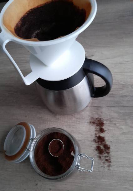 istock preparing fresh coffee in coffee filter and coffee pot 1285043726