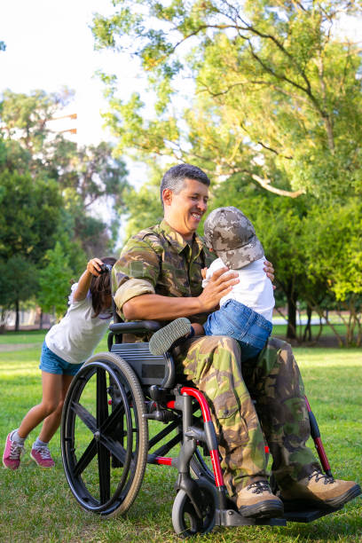 istock Joyful disabled military dad walking with two children 1285043910