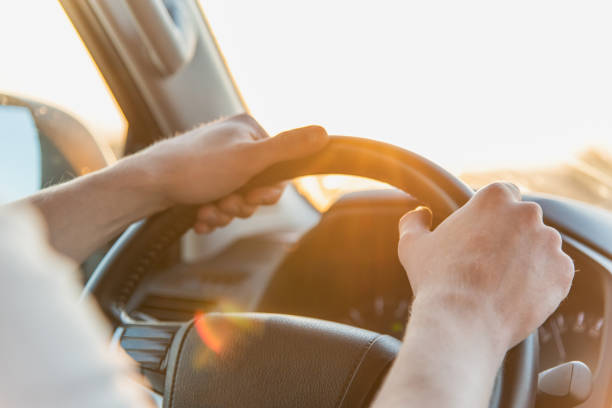 istock A man driving a car on a Sunny day 1285048113
