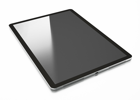 Mockup image of a woman holding digital tablet with blank desktop screen while lying on a sofa at home