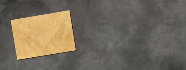istock Brown paper enveloppe mockup template on horizontal concrete banner 1285052068