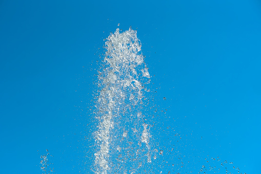 Photograph of a body of water in a bathtub filler, in movement.