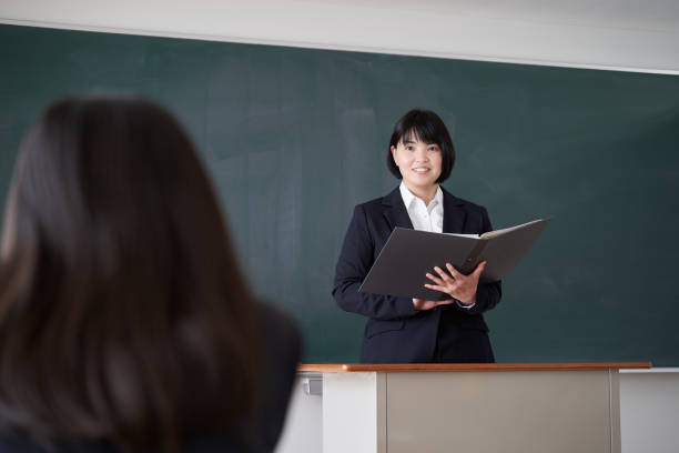 istock A Japanese female teacher asks a student in the classroom 1285057906