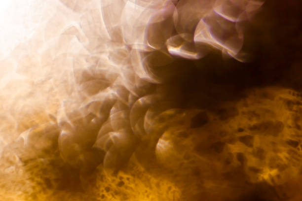 istock Defocused glittering black background of warm bokeh lights 1285059316