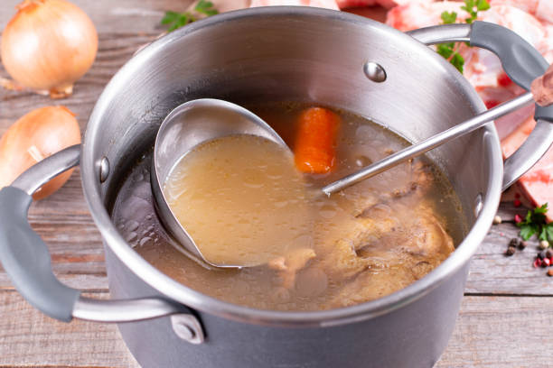 istock Bone Broth Bouillon in Metal saucepan on the table, paleo diet 1285060804