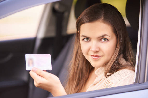 istock Driver lesson student. Happy joyride people. Person in car 1285061182