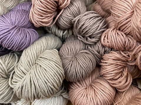 Closeup photo of a beautiful collection of coloured woollen yarn