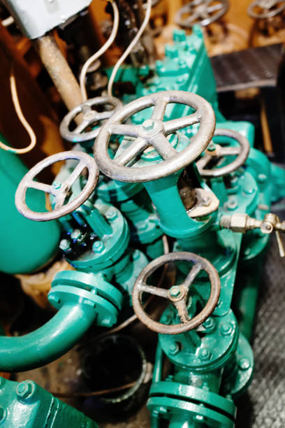 istock Old aged gray pipes and valves 1285062232