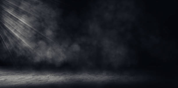 istock Studio dark room concrete floor grunge texture background with fog or mist and lighting effect. 1285064726