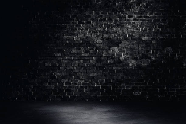 istock Studio dark room brick wall and  concrete floor grunge texture background. 1285064770