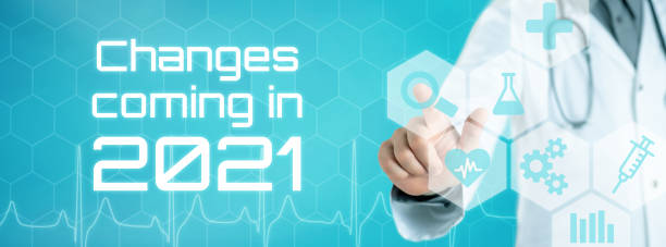 istock Doctor touching an icon on a futuristic interface - Changes coming in 2021 1285064919