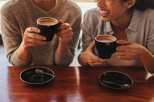 istock Two friends having coffee together 1285066618