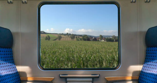istock An empty blue seat in europe german train with window corn field display nature summer view on the railway road transportation during coronavirus 1285067157