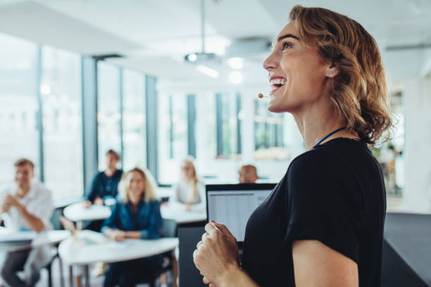 istock Cheerful business woman giving a presentation 1285067651