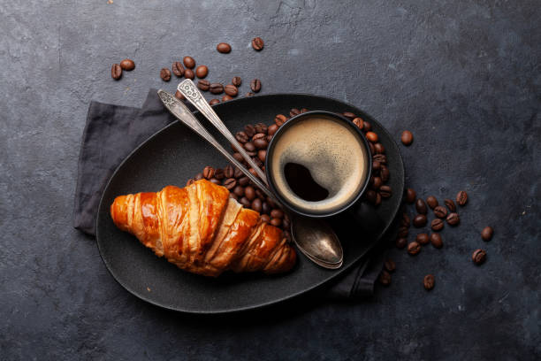 istock Espresso coffee and croissant for breakfast 1285072939